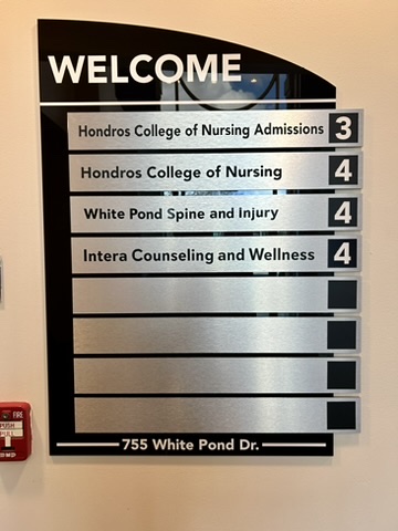 Welcome sign in a lobby. Intera counseling and Wellness is listed on floor 4.