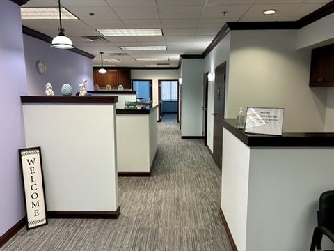 Inner office of Intera. An open office view of a reception area with a seating area to the right.